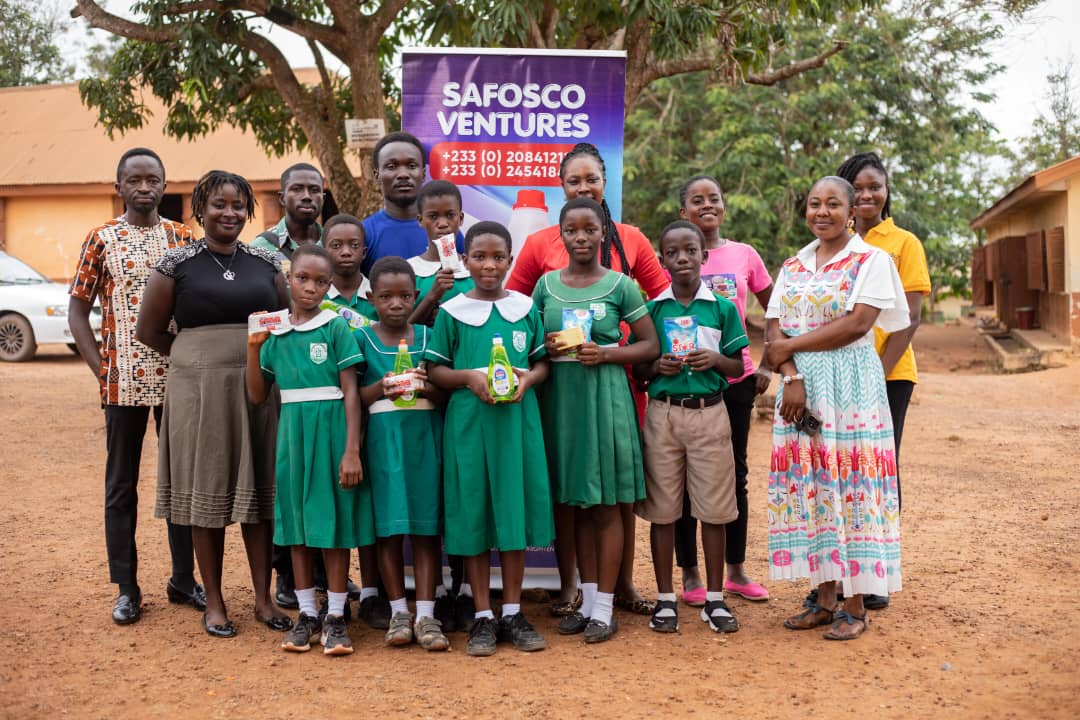 Safosco team and students holding STAR products beside a Safosco Ventures banner